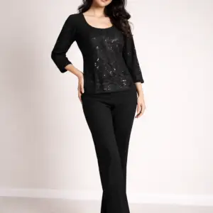 Model wearing Black Sequinned Evening Top with round neckline and straight sleeves, front view on neutral studio background